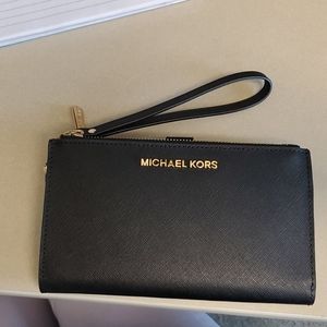 black Michael Kors wristlet